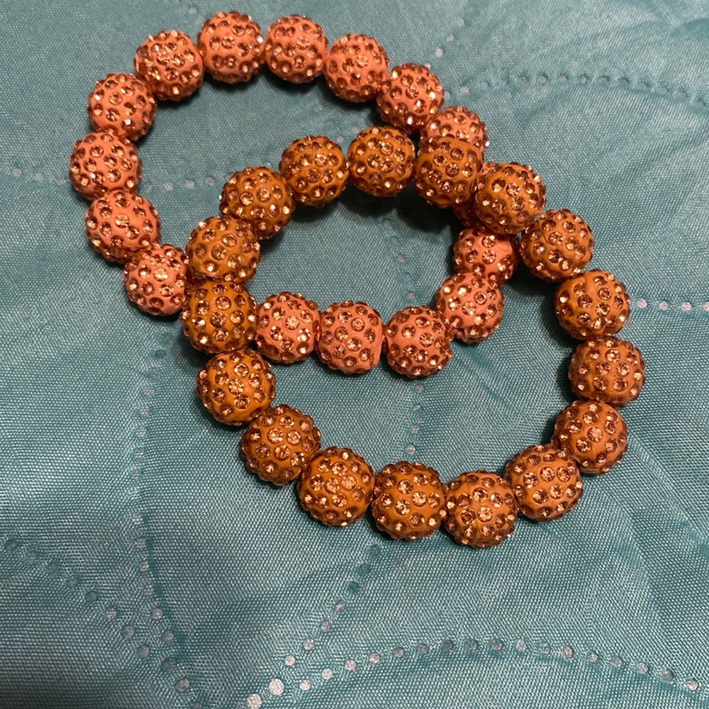 Set of 2 stretchy glitter ball bracelets one gold one rose gold